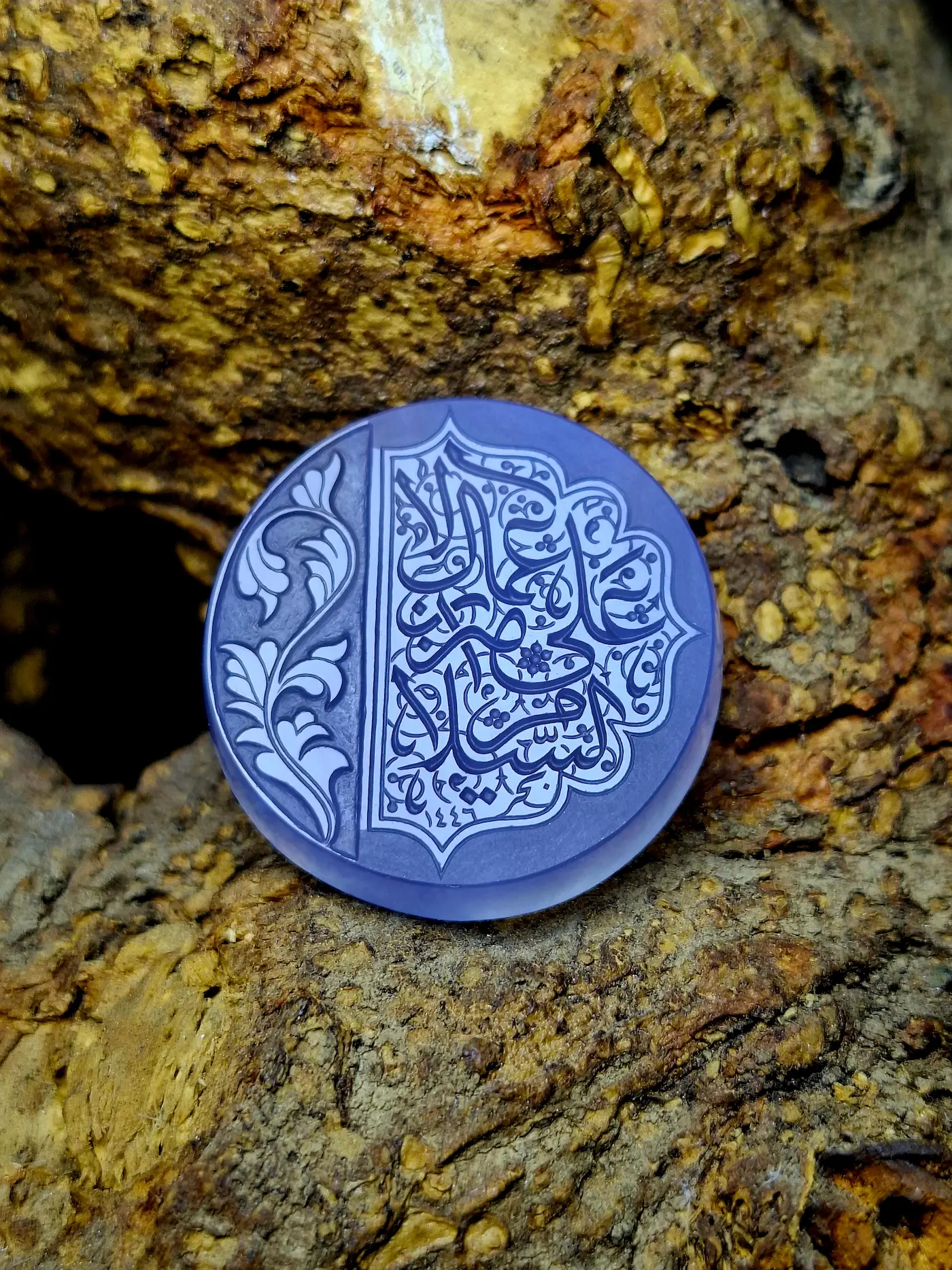 Stone Engraving by Mohsen Karimi. Blueish stone with beautiful flower and arabic sols carvings